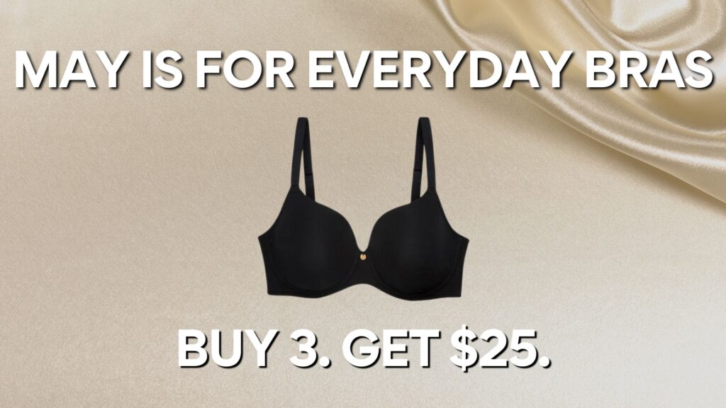 Promotional graphic with a smooth beige satin background, featuring a black everyday bra centered between bold white text that reads "MAY IS FOR EVERYDAY BRAS" at the top and "BUY 3. GET $25." at the bottom.